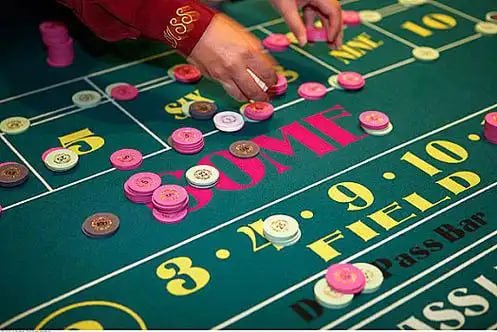 Exclusive high roller VIP casino entrance with luxurious gaming tables